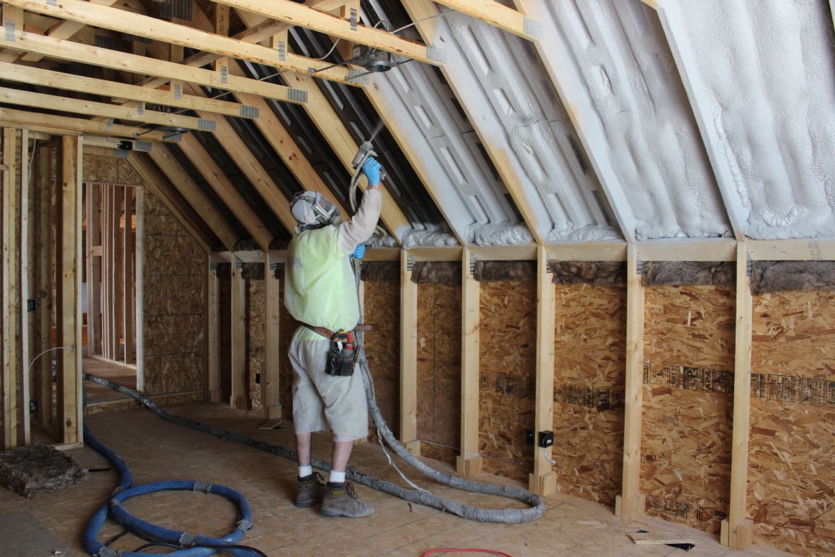Team member working on insulation